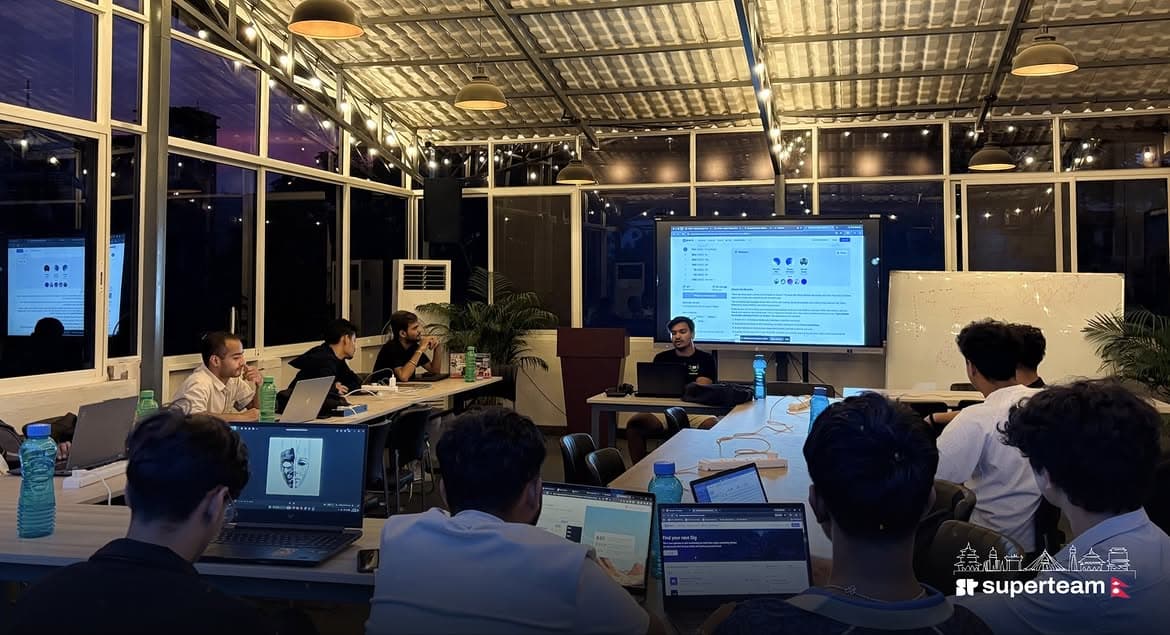 Community members working together around a laptop